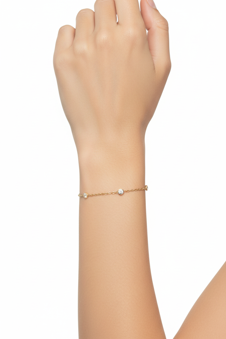 Gold diamond bracelet on woman's wrist