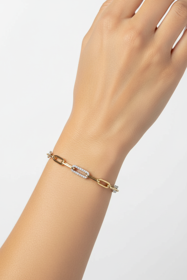 Two-tone chain link bracelet on woman's wrist