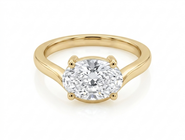 Gold ring with a diamond on a white background