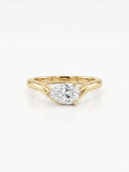Gold ring with a diamond on a white background