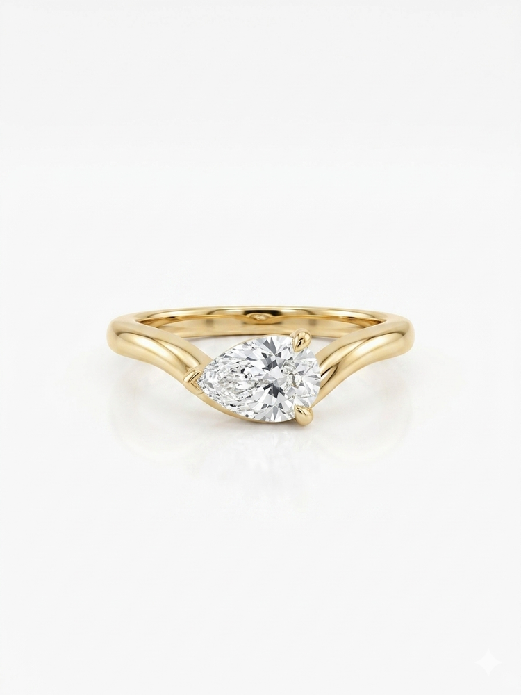 Gold ring with a diamond on a white background