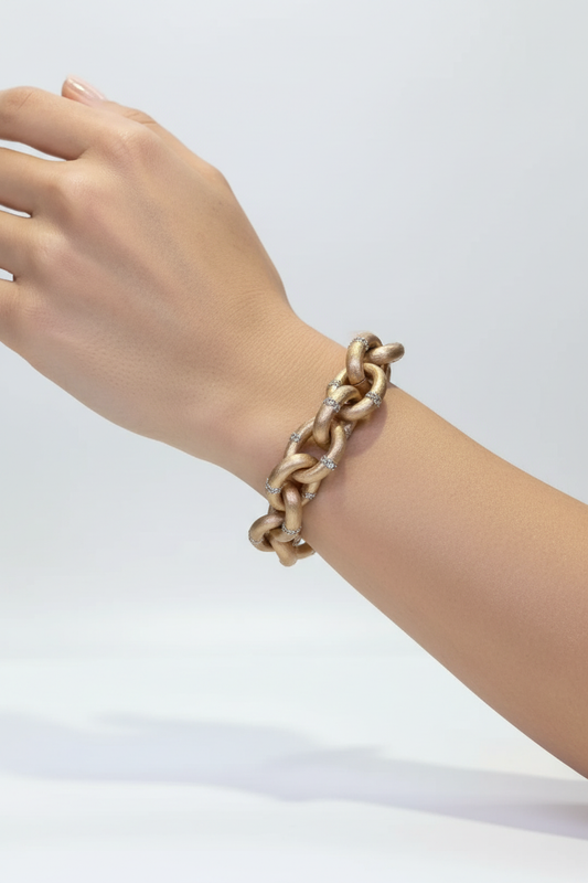 Gold chain link diamond bracelet on woman's wrist